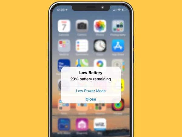 iPhone battery draining fast showing low battery warning on screen